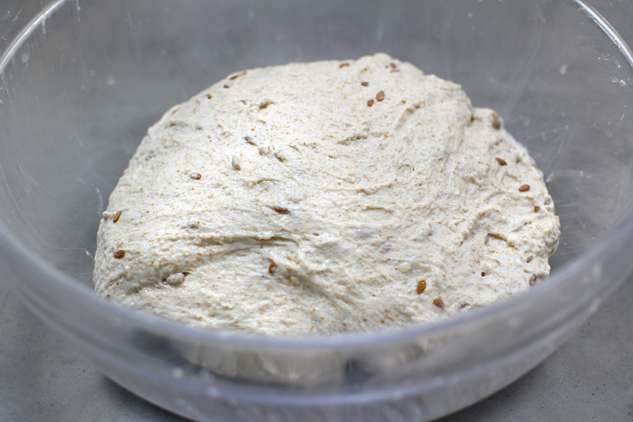 the first fold of the dough with seeds and whole wheat flour